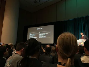 A GDC session audience facing a slide comparing Unity Lightweight and High Definition render pipelines